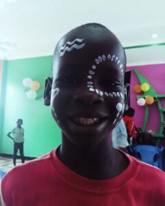 Child creating artwork during a mental health support session