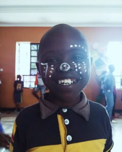 Child creating artwork during a mental health support session